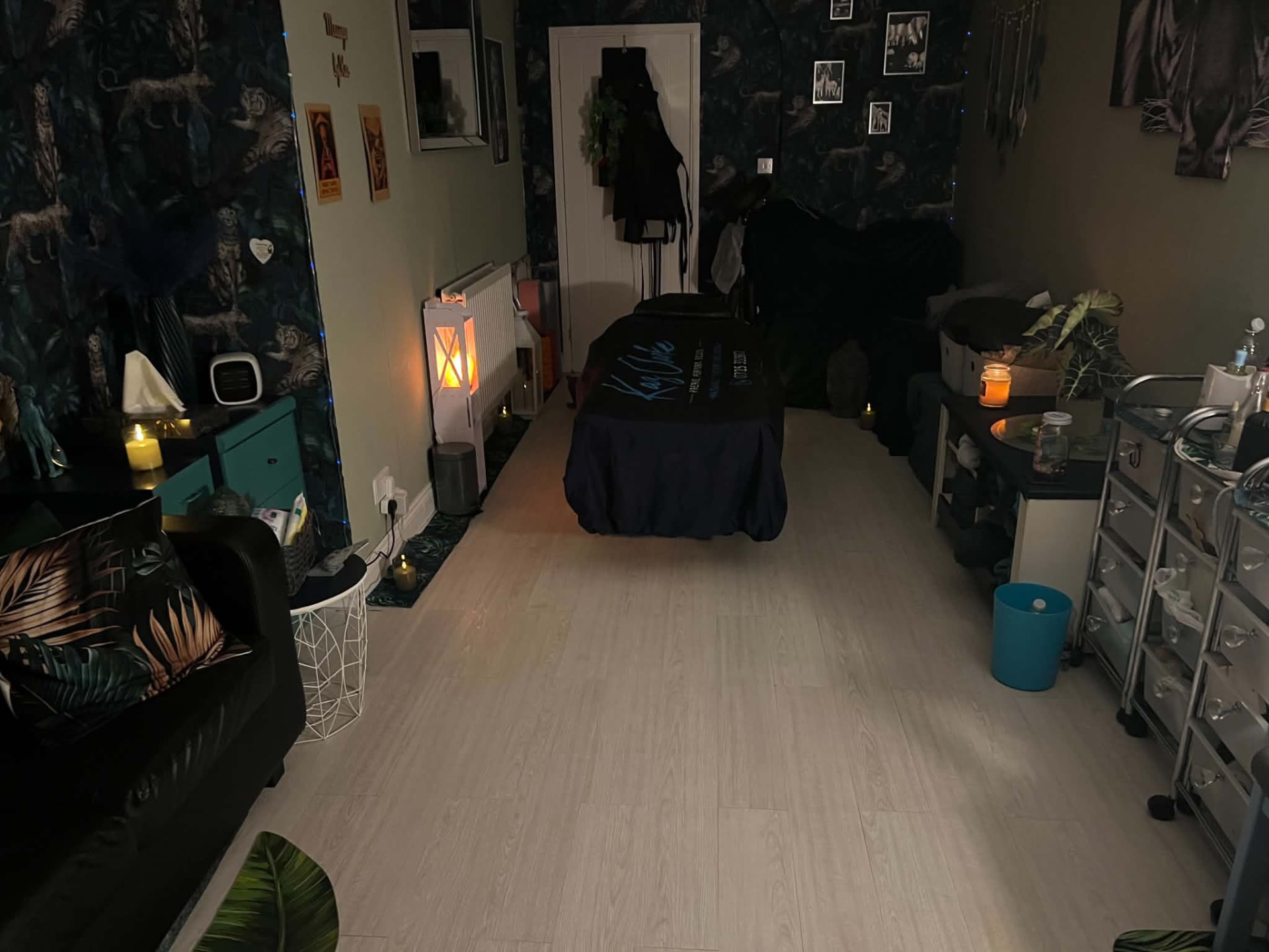 Massage couch prepared in the candlelit studio